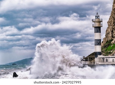 "Lighthouse amidst stormy sea, waves crashing, cloudy sky overhead." - Powered by Shutterstock