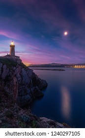Lighthouse of Aviles at the entrance of the river, light from the port to the beach of San Juan and Salinas