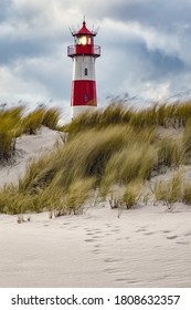 Lighthouse And Beach Grass On A Windy Day