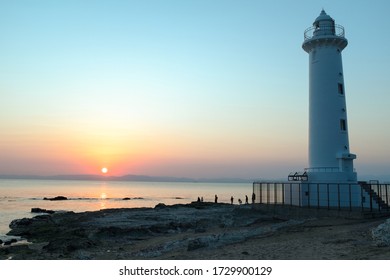 Lighthouse of beach side with sunset.