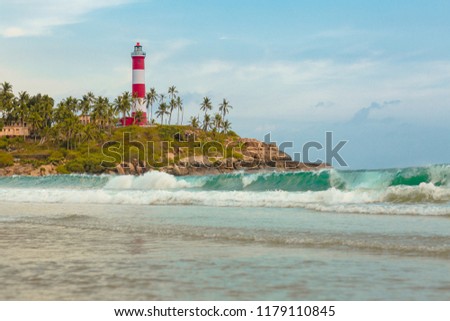  Lighthouse beach at Trivandrum, India. Blue hues and Travel photo.  . Holiday in Beautiful Kerala. Coastline of Kovalam.