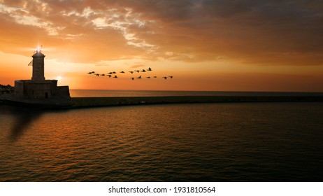 Lighthouse With Beacon In The Evening Sun