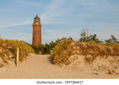 The lighthouse behind the dunes