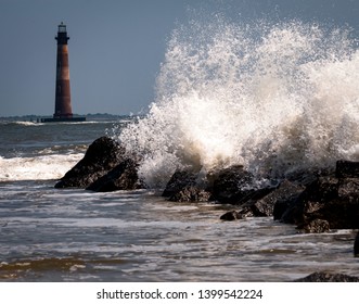 Lighthouse with the breaking wave.