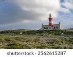 Lighthouse of Cape Agulhas, the geographic southern tip of Africa and the beginning of the traditional dividing line between the Atlantic and Indian Oceans