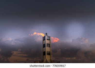 Lighthouse in cloudy sky
