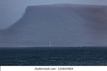 Lighthouse Dwarfed By Knocknarea