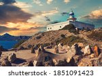 Lighthouse El Hoyo in Portman village view during picturesque bright sunset cloudy sky background, Europe, Cartagena. Spain