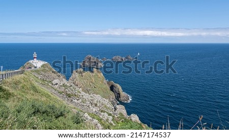 Lighthouse of Estaca de Bares in Lugo, Spain, with the sea in the background