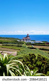 Lighthouse Farol da Ponta da Ferraria, Island Sao Miguel, Azores, Portugal, Europe. View from Miradouro da Ilha Sabrina.