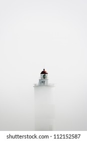 Lighthouse In Fog