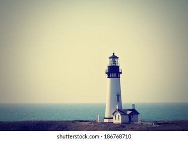  a lighthouse in the fog done with a retro vintage instagram filter  - Powered by Shutterstock