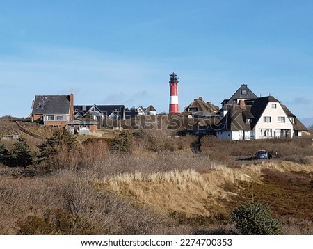 Lighthouse and Frisian Houses in Hoernum on Sylt in Germany