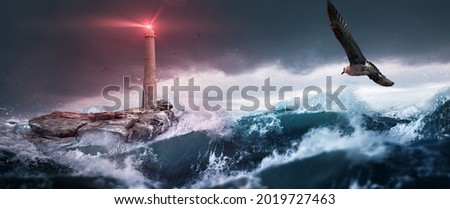  lighthouse in front of stormy sea