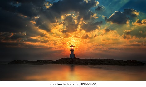 Lighthouse With Light Beam At Sunset At Khao Lak