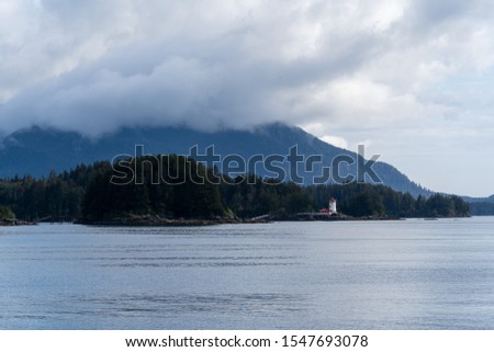 Similar – Image, Stock Photo Alaska | lonely lighthouse on the sea way to Juno