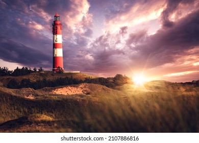 Lighthouse on Amrum at sunset with dramatic clouds