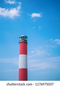 Lighthouse on blue sky background - Shutterstock ID 1176975037