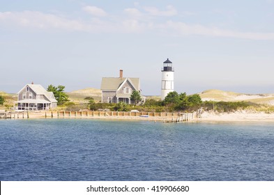 Lighthouse On Cape Cod With Beach And Water