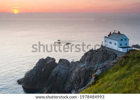 Lighthouse on the cliff edge 