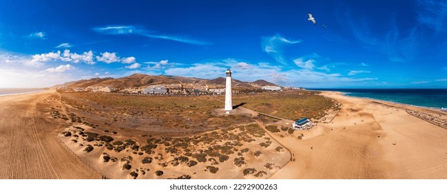 Lighthouse on Morro Jable beach on Jandia peninsula in sunrise light, Fuerteventura, Canary Islands, Spain. Faro de Morro Jable Lighthouse, Fuerteventura.