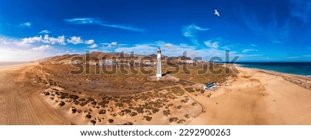 Lighthouse on Morro Jable beach on Jandia peninsula in sunrise light, Fuerteventura, Canary Islands, Spain. Faro de Morro Jable Lighthouse, Fuerteventura.