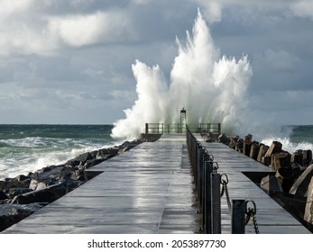 Lighthouse On The Pier Of Norre Vorupor During Storm And Heavy Sea, Jutland, Denmark