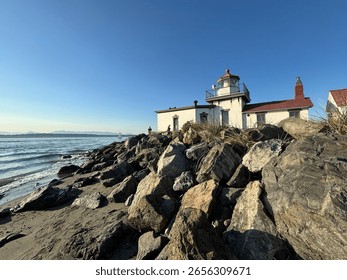 Lighthouse on a platform of rocks set next to water