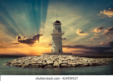 Lighthouse on the sea under sky.