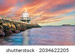 Lighthouse on top of a rocky island in Maine