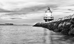 Lighthouse On Top Of A Rocky Island In Maine
