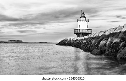 Lighthouse on top of a rocky island in Maine - Powered by Shutterstock