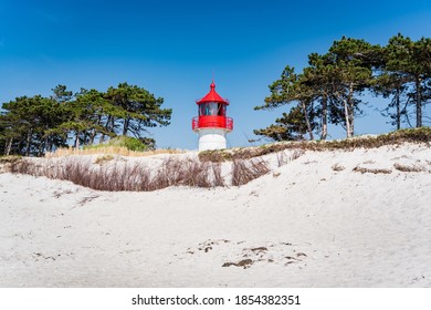 Lighthouse On The White Sand Beach In Rügen 