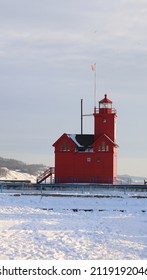 Lighthouse On Winter Lakeshore Beach