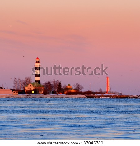 lighthouse in port of Riga at the sunrise