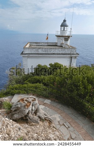 Lighthouse in Portofino. Landscape, view from the peninsula to the sea. Portofino, Liguria, Italy