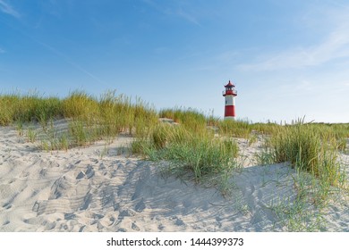  Lighthouse red white on dune. Sylt island – North Germany. Focus on background with lighthouse. - Powered by Shutterstock