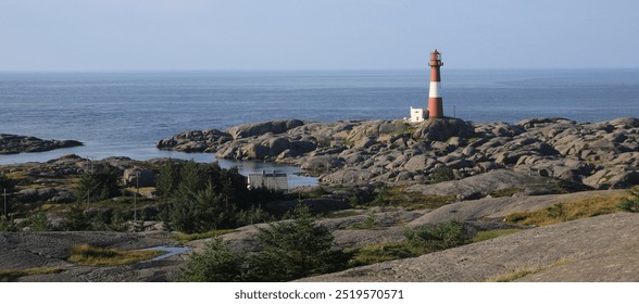 Eigerøy lighthouse, rock formations and North Sea, Norway. - Powered by Shutterstock