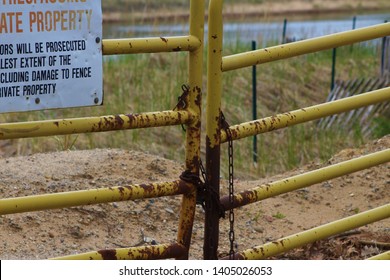 Lighthouse, rusty fence and miscellaneous object.
