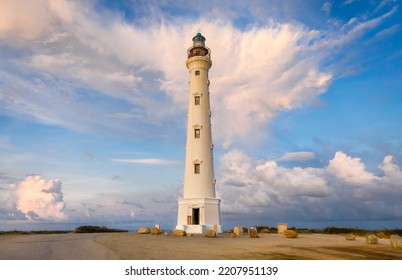 Lighthouse at sunset with clouds