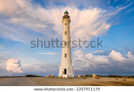 Lighthouse at sunset with clouds