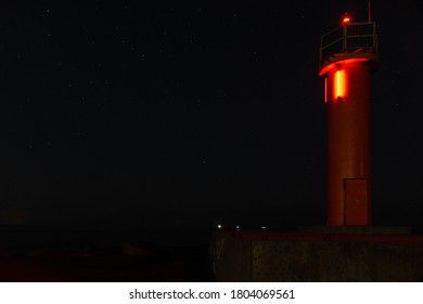 Lighthouse in the sunset and the moon rise while watching Perseids meteor shower.