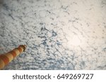 Lighthouse top on sky and clouds background 