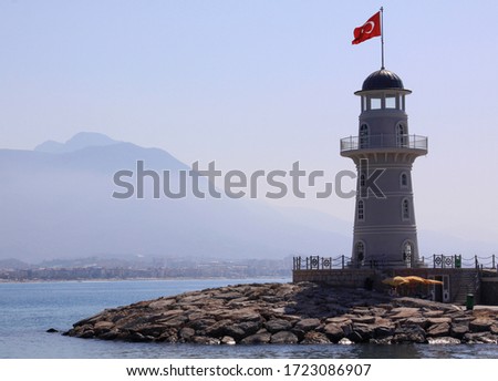 Lighthouse with the Turkish flag, in Alanya port, Turkey