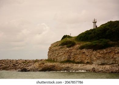 lighthouse and wavy ocean view