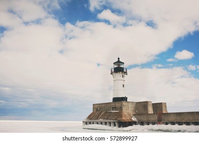 Lighthouse with White Clouds Background