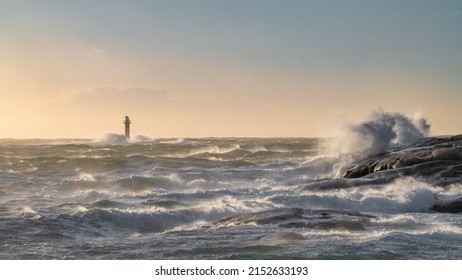Lighthouse in windy sea with high waves