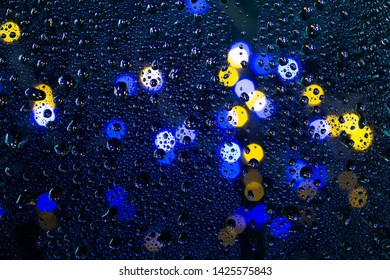 Lighting Background Boken And Raindrops On The Glass