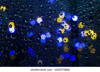 Lighting Background Boken And Raindrops On The Glass