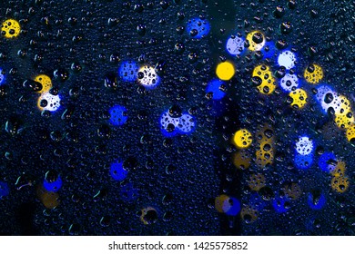 Lighting Background Boken And Raindrops On The Glass